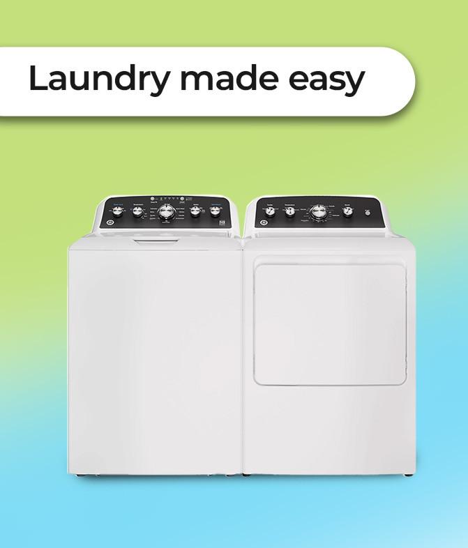 Washer with laundry detergent and towels.